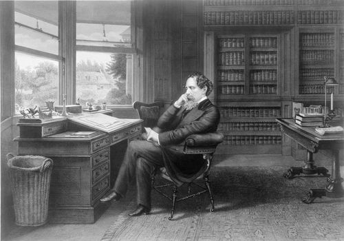Charles Dickens seated in his library at Gad's Hill